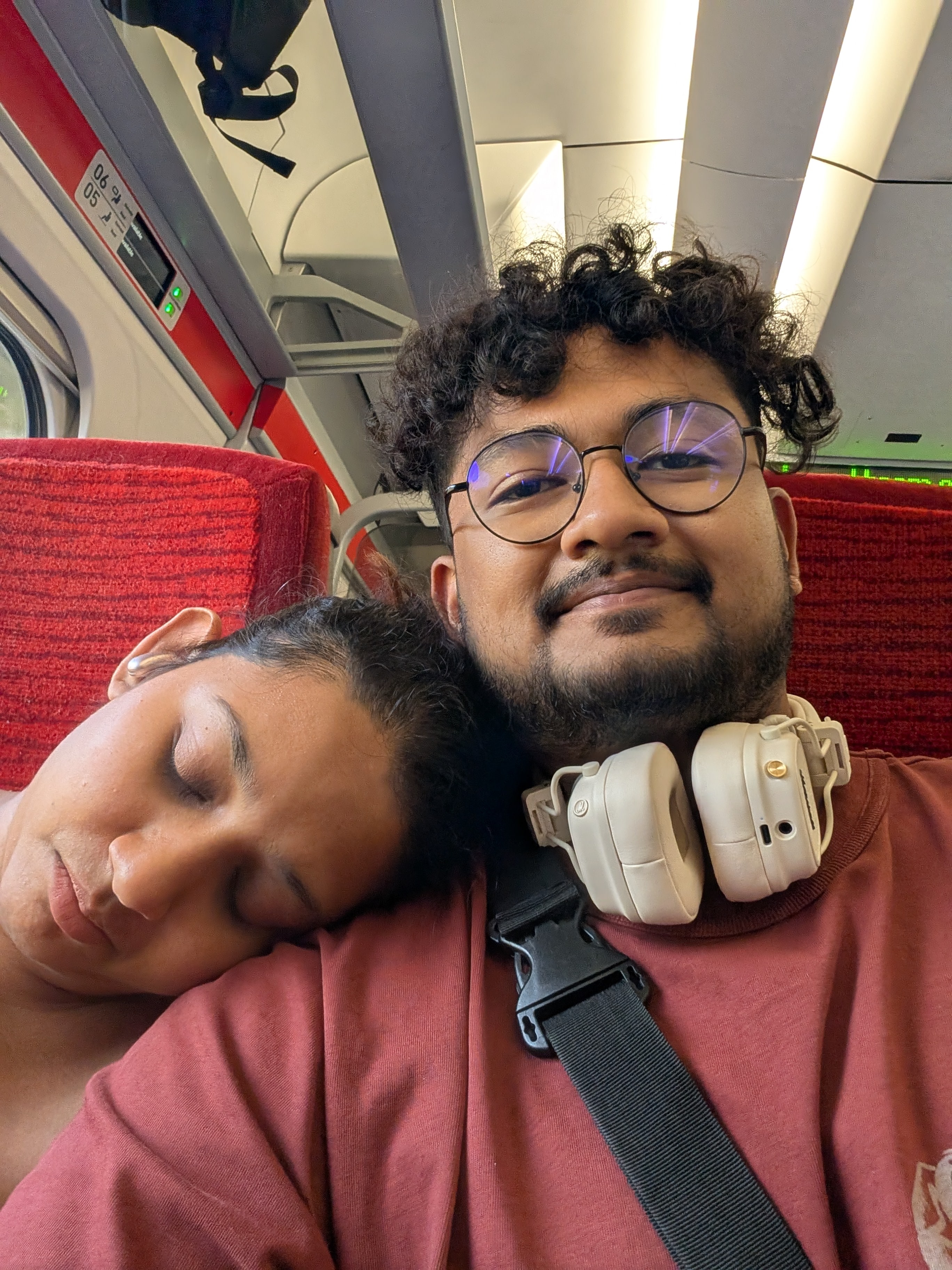 Rajshree resting beside Deepesh during a journey